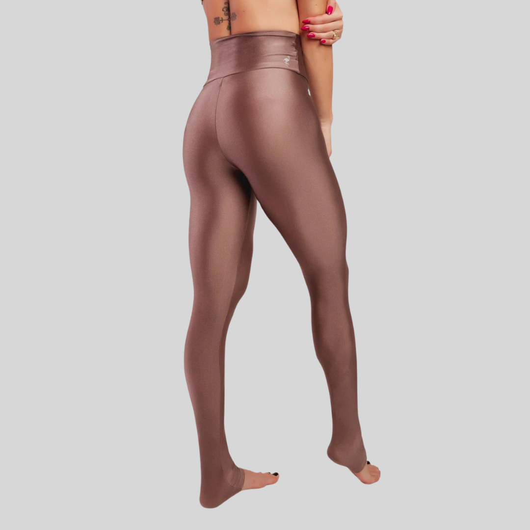 Brown leggings worn by a person on a light gray background