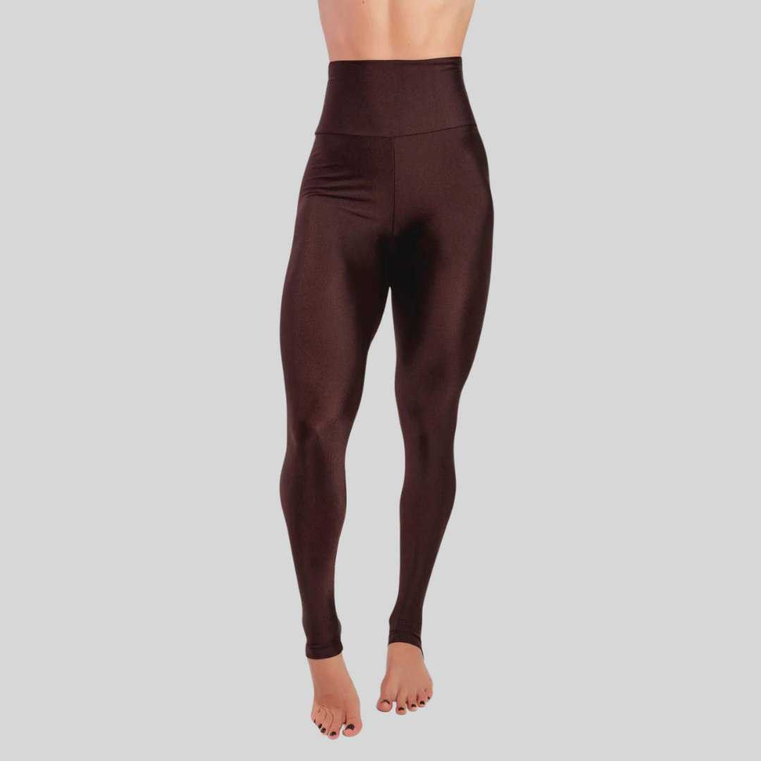 Brown leggings worn by a person on a gray background