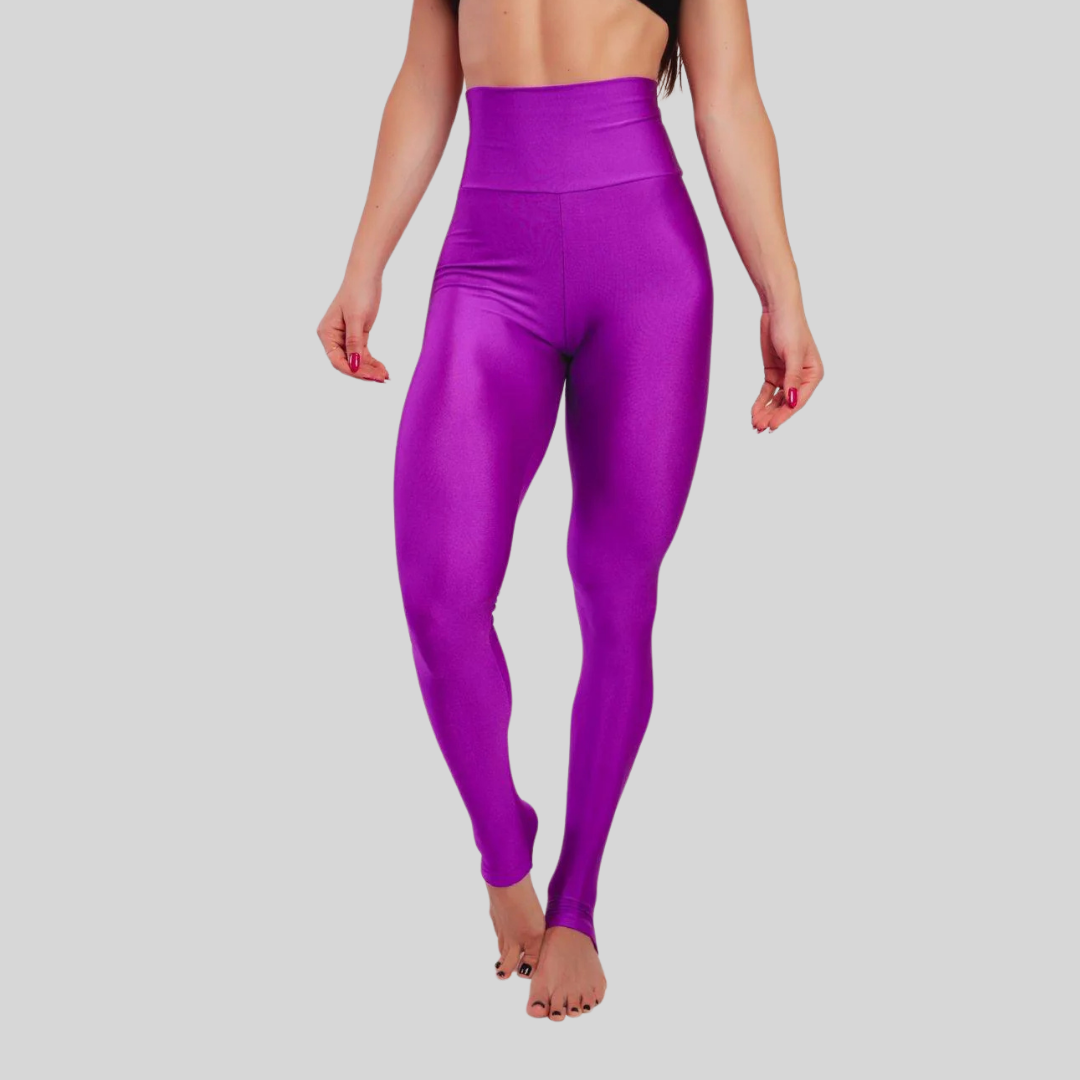 Person wearing bright purple leggings on a gray background