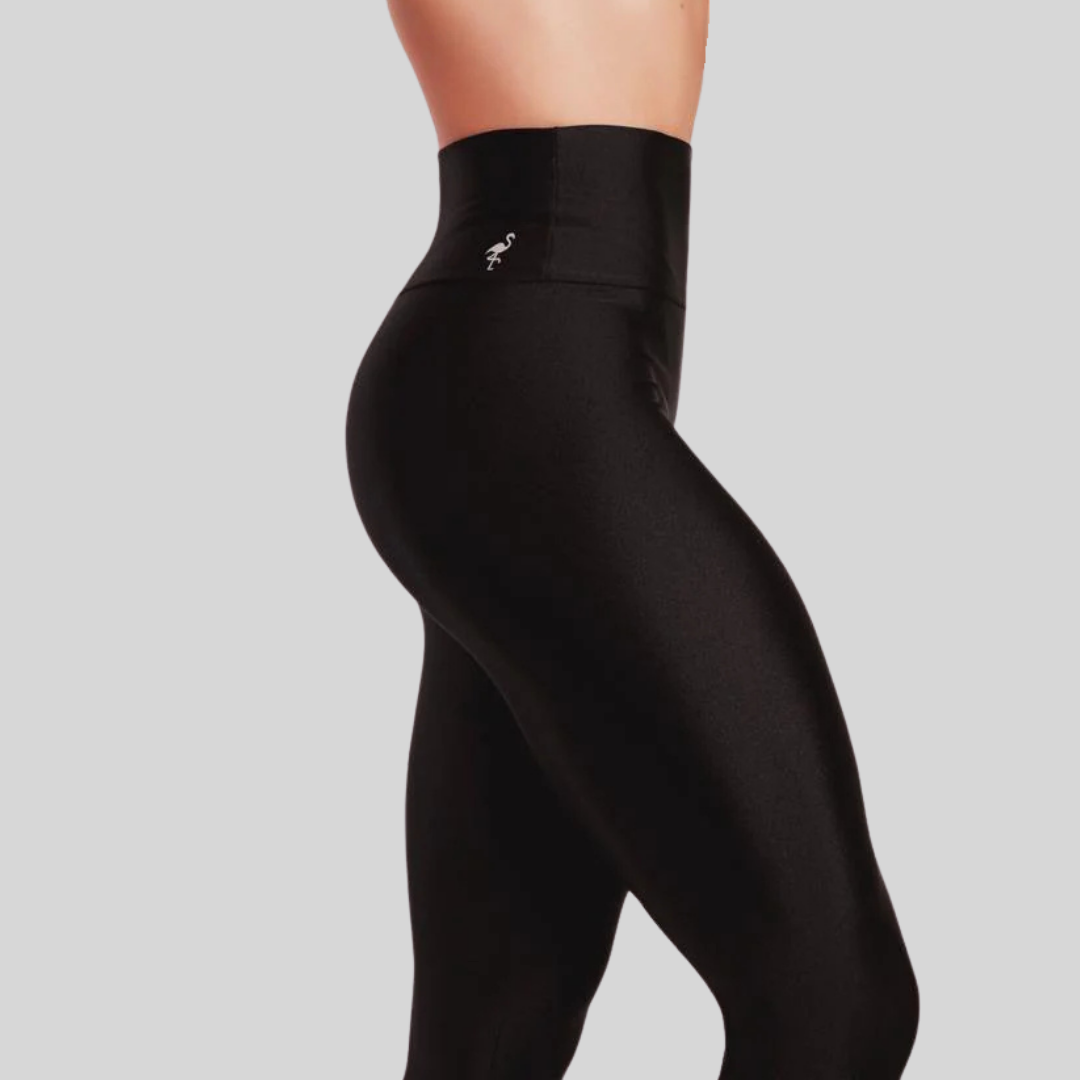 Black leggings with a brand logo on a gray background