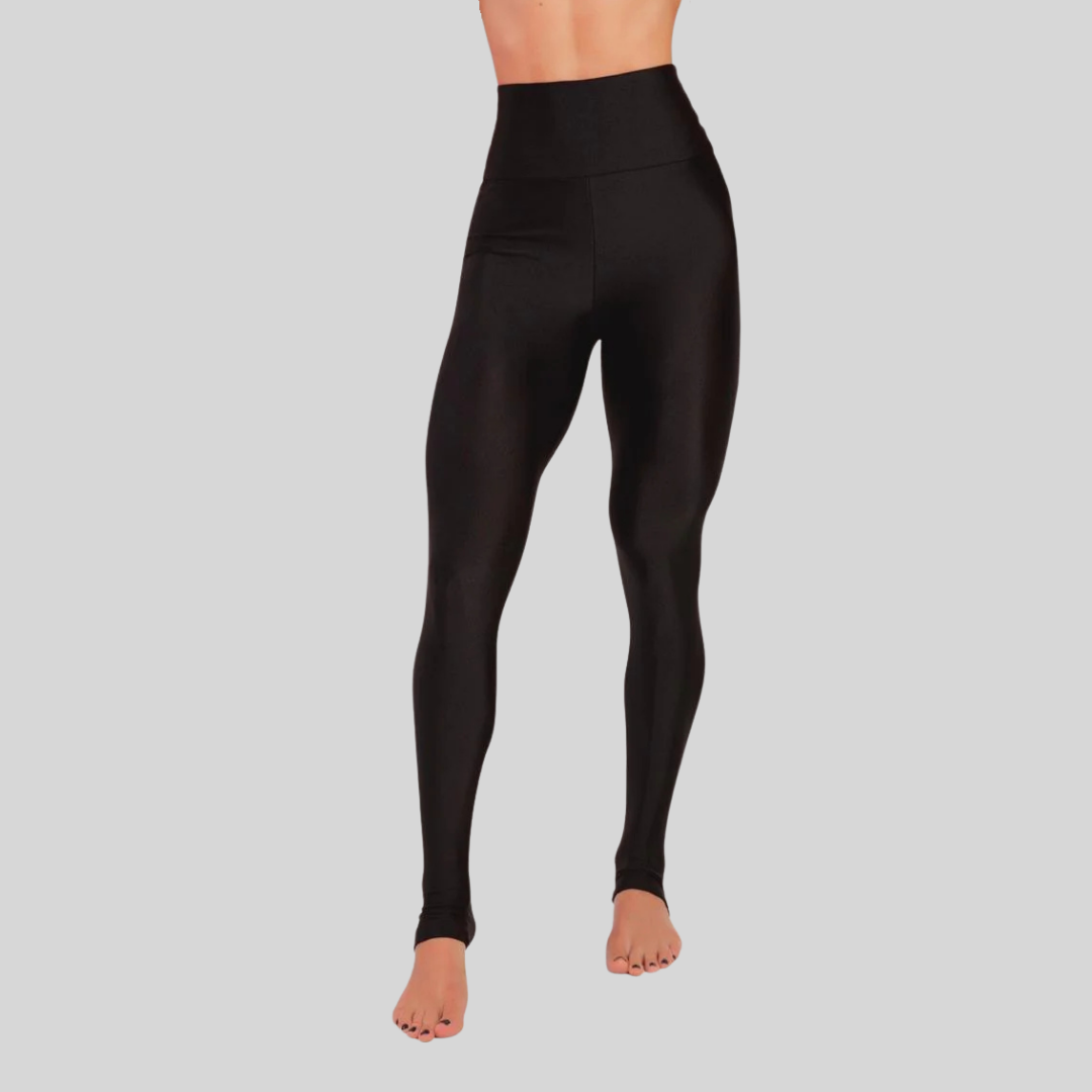 Black leggings worn by a person on a gray background
