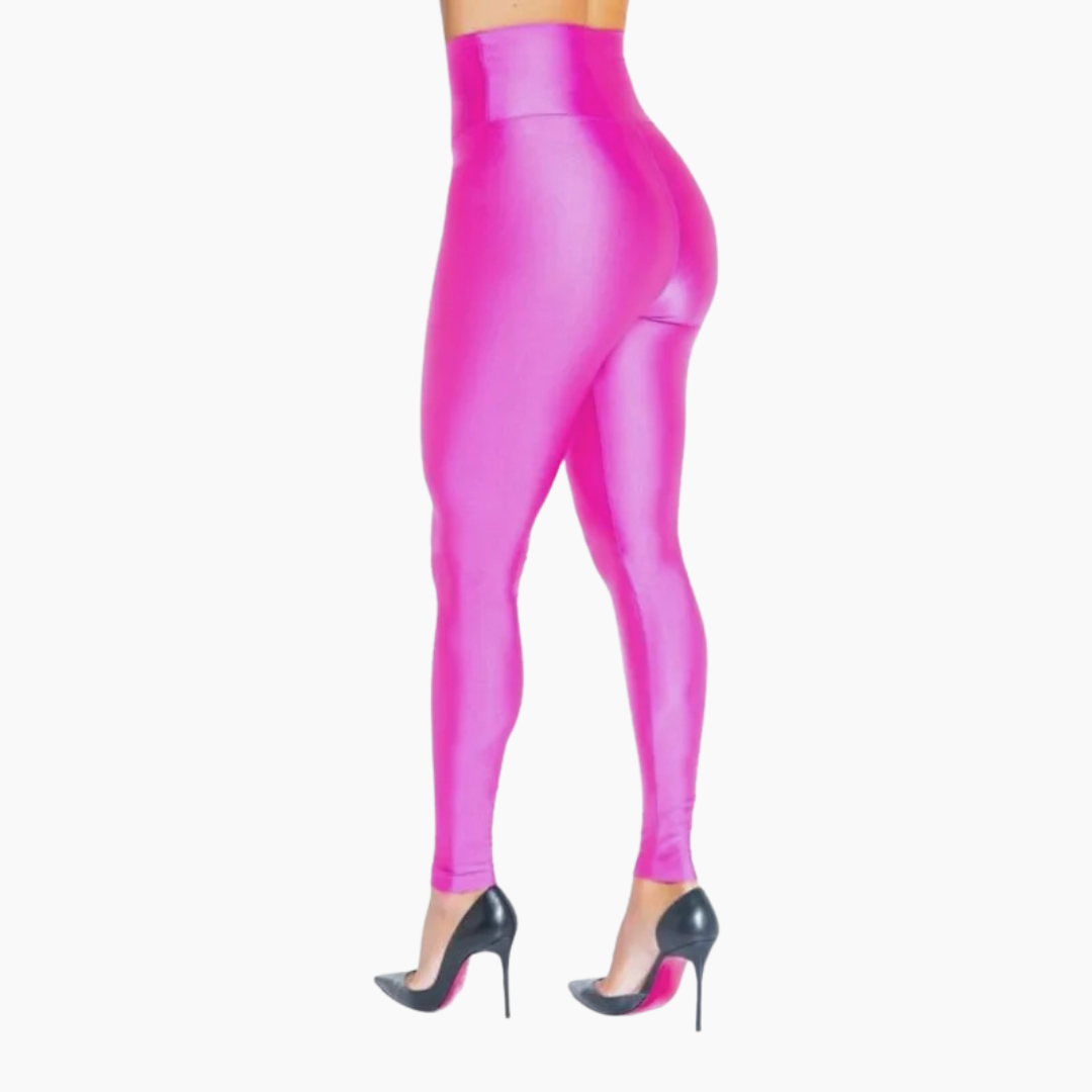 Pink leggings worn by a person on a white background