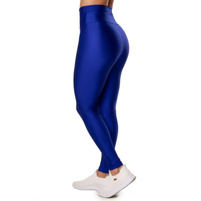 Blue leggings worn by a person on a white background